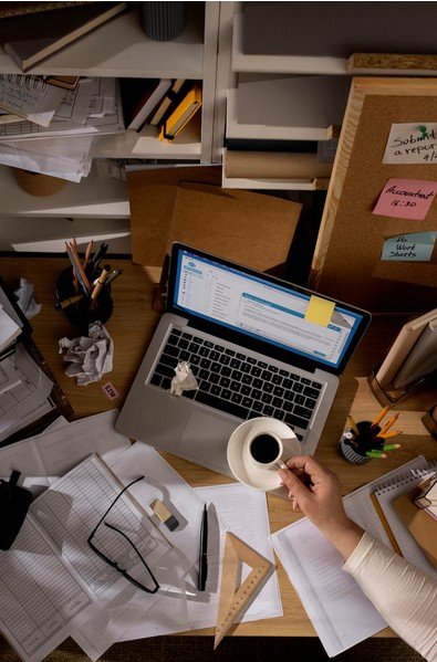 work space, were seen a pc and cup of coffe