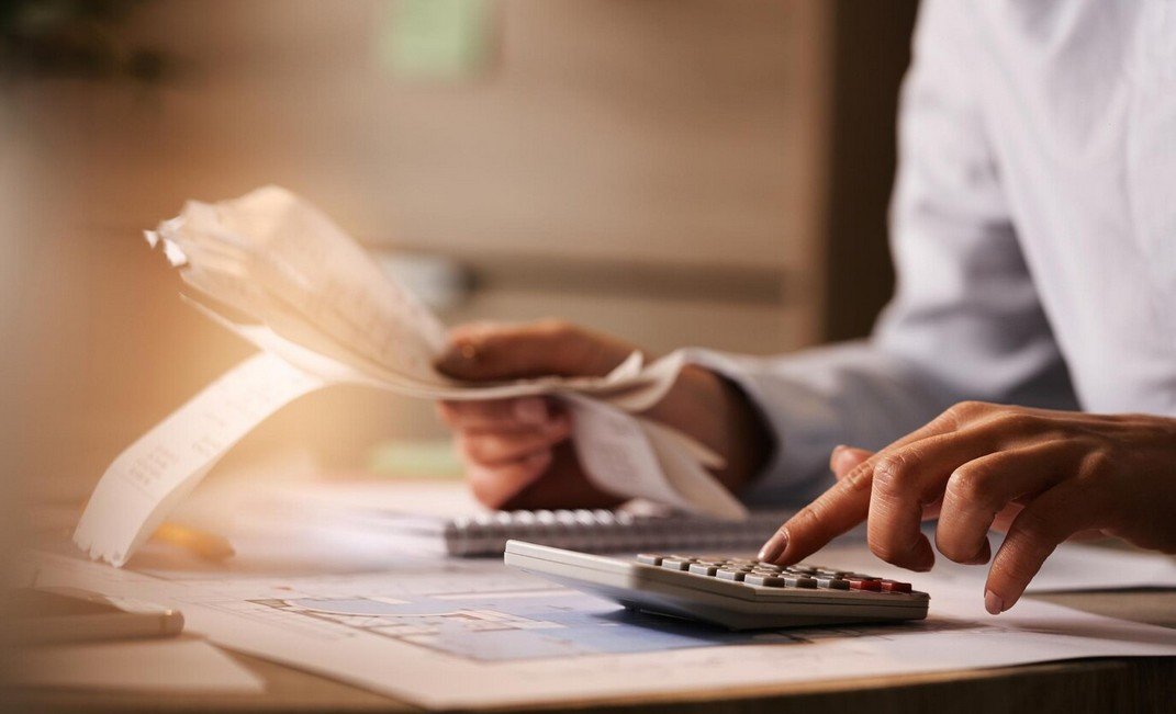 A Woman using a calculator