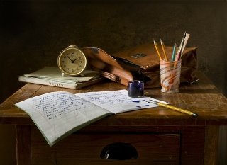 image showing notebook, clock and pens
