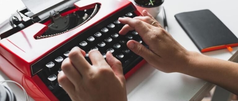 a woman typing on a typing machine